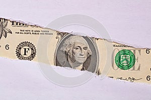 1 US dollar banknote in torn paper hole