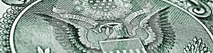 1 US dollar. Fragment of banknote. Reverse of bill with the Great Seal. The bald eagle is national symbol. Gray-green tinted