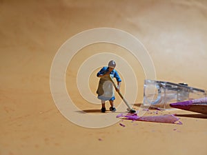 1 woman cleaning trash from pencil sharpener with negative space