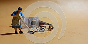 1 woman cleaning trash from pencil sharpener with negative space