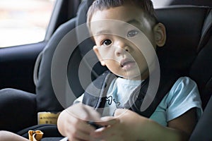 1 Year Old Adorable Asian Boy Alone Looking Around From Car Seat in the Car