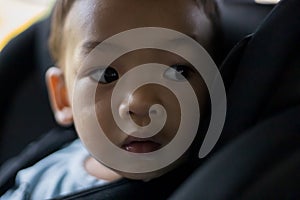 1 Year Old Adorable Asian Boy Alone Looking Around From Car Seat in the Car