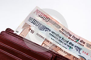 10, 100 and 1000 rupees notes in leather wallet