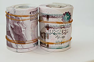 10 EGP LE ten Egyptian pounds cash money bills rolled up with rubber bands with a image of Al Rifa'i the royal mosque