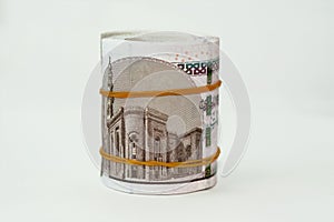 10 EGP LE ten Egyptian pounds cash money bills rolled up with rubber bands with a image of Al Rifa'i the royal mosque