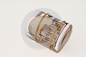10 EGP LE ten Egyptian pounds cash money bills rolled up with rubber bands with a image of Al Rifa'i the royal mosque