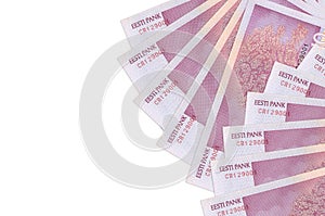 10 Estonian kroon bills lies isolated on white background with copy space. Rich life conceptual background