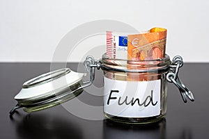 10 Euro note in the jar for Fund