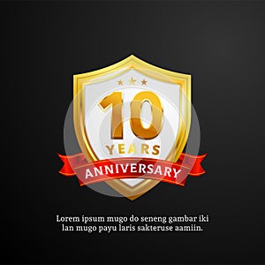 10 years anniversary logo badge vector design. shiny shield with ribbon for birthday event celebration background
