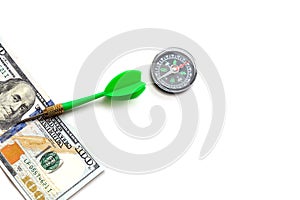 100 american dollars on a white background and compass, to make correct and accurate investment