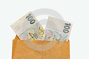 100 Czech crowns banknote closeup in paper envelop isolated