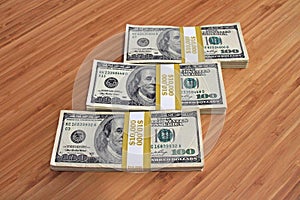 $100 dollar bills stacks - cash stacks on the table