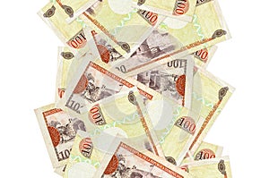 100 Dominican peso bills flying down isolated on white. Many banknotes falling with white copyspace on left and right side