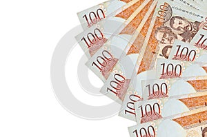 100 Dominican peso bills lies isolated on white background with copy space. Rich life conceptual background