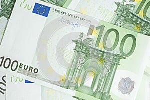 100 euro bill. Europein money banknote. Hundred euro bills on wooden background