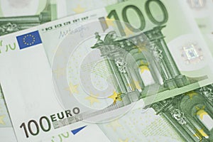 100 euro bill. Europein money banknote. Hundred euro bills on wooden background