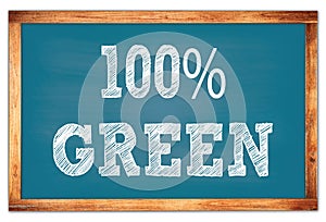 100% GREEN words on blue wooden frame school blackboard