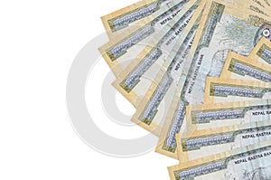 100 Nepalese rupees bills lies isolated on white background with copy space. Rich life conceptual background