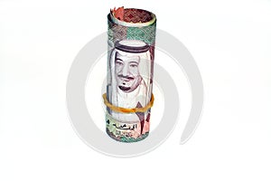 100 one hundred Saudi Arabia money roll riyals banknotes isolated on white background, Saudi riyals cash money bills rolled up