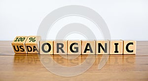 100 percent organic symbol. Fliped wooden cubes and changed words USDA organic to 100 percent organic. Beautiful white background