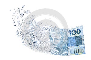 100 reais banknote evaporating in the air, money losing value, financial crisis and devaluation of the Brazilian real