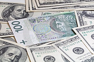 100 US  dollar and 100 polish zloty banknotes