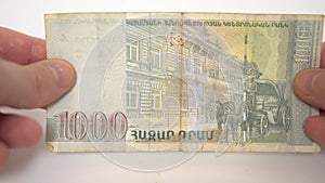 1000 Armenian dram in hands, armenian money, bank of armenia, famous Armenian poet and writer Yeghishe Charents