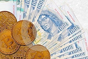 1000 Hungarian forint bills and golden bitcoins. Cryptocurrency investment concept. Crypto mining or trading
