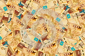 1000 Kazakhstani tenge bills lies in big pile. Rich life conceptual background