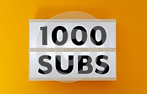 1000 subs on yellow background