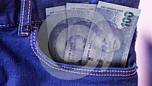 100000 Uzbekistan Som Banknotes in Pocket of Jeans