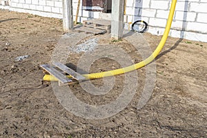 100mm diameter yellow PVC pipe connected to the end of the gutter on the roof, protected against water.