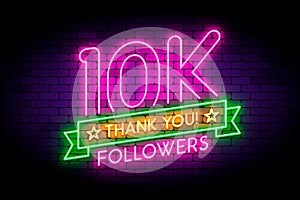 10K, 10000 followers neon sign on the wall.