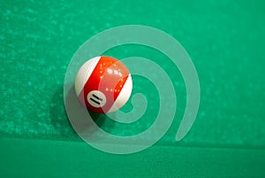 11 Ball from pool or billiards on a billiard table