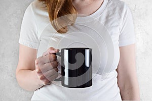 11 oz. Black Coffee Mug Mockup - Glossy Black Mug Held by Young Woman
