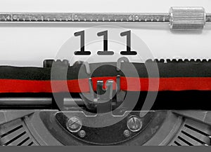 111 Number by the old typewriter on white paper