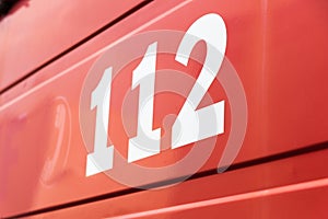 112 the emergency number on a red background
