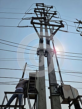 115kV Load Break Switch on blue sky with the sun shining background