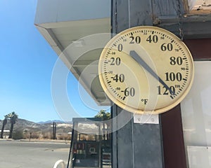 118 degrees Fahrenheit on vintage outdoor thermometer.