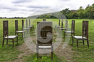 12 bronze chairs - Jurors artwork by Hew Locke in Runnymede, Surrey, UK