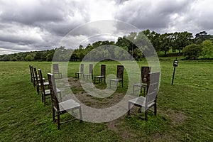 12 bronze chairs - Jurors artwork by Hew Locke in Runnymede, Surrey, UK