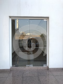 12 millimeters thick toughened Glass door with Stainless steel made tube glass Doors and its floor and lintel mounted Doors which