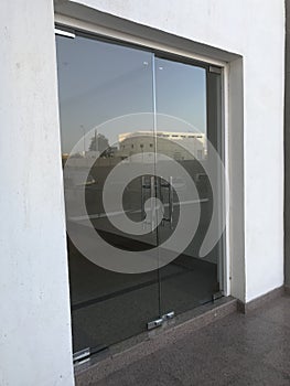 12 millimeters thick toughened Glass door with Stainless steel made tube glass Doors and its floor and lintel mounted Doors which