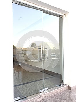 12 millimeters thick toughened Glass door with Stainless steel made tube glass Doors and its floor and lintel mounted Doors which