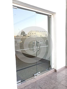 12 millimetres thick toughened glass door with stainless steel made tube glass doors and its floor and lintel mounted doors which