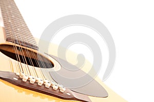 A 12 string acoustic guitar on a white background