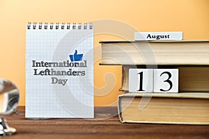 13th august - International Lefthanders Day. Thirteenth day month calendar concept on wooden blocks with copy space