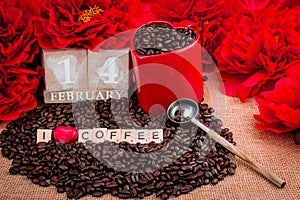 14 February rosted coffee beans with heart chocolates red flowers and letters I LOVE Coffee