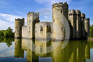 14th century Bodium castle surrounded by a moat in the County of Sussex in England.