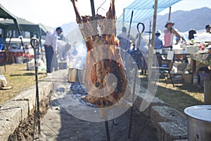 15-02-2019 Lonquimay, Chile. Meat roasted on the stick by a Chilean gaucho in Lonquimay, Chile